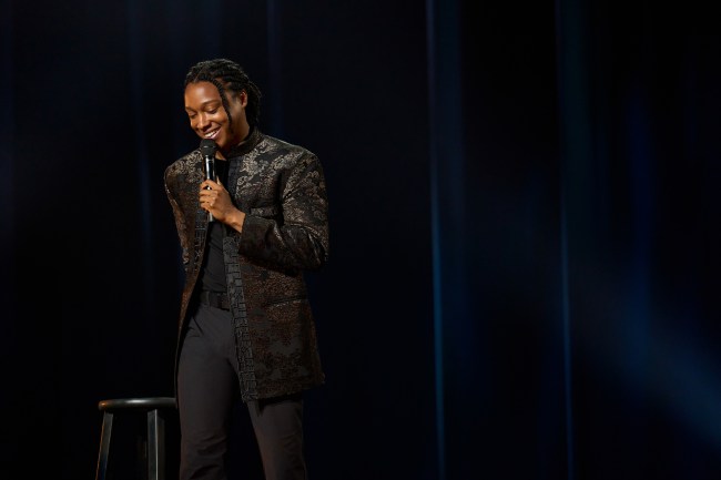 Josh Johnson standing on stage in 'Josh Johnson: Symphony' 
