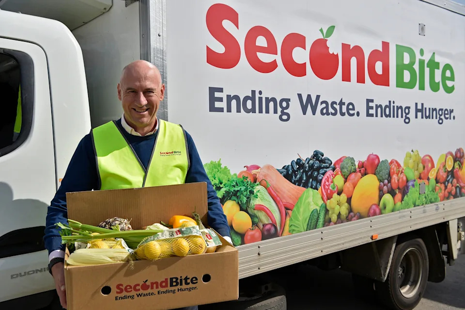 CEO Daniel Moorfield in Sydney holding a box of fruit.