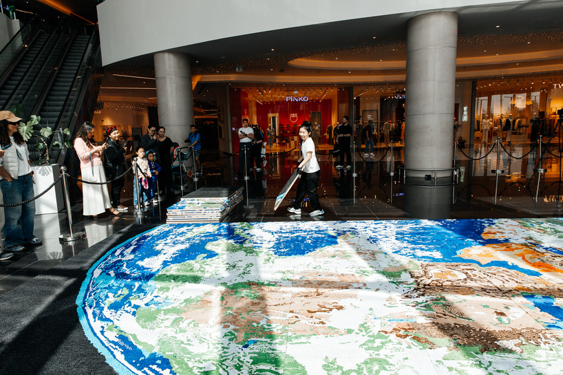 thousands of hand-rolled paper quills compose monumental mosaic earth artwork - 3