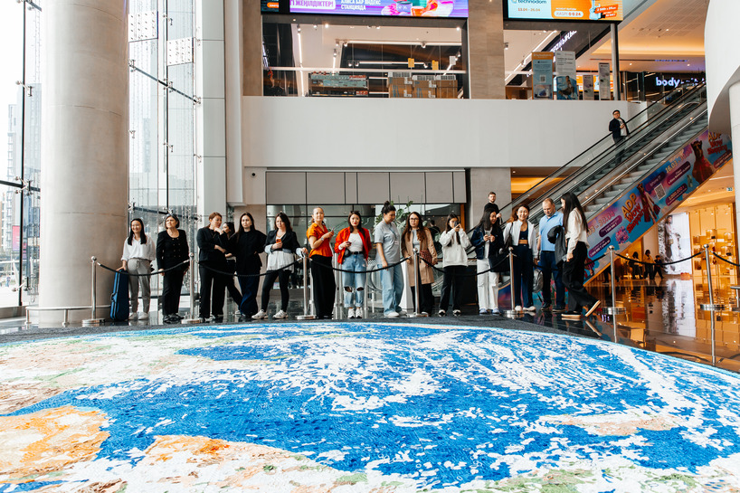 thousands of hand-rolled paper quills compose monumental mosaic earth artwork - 4