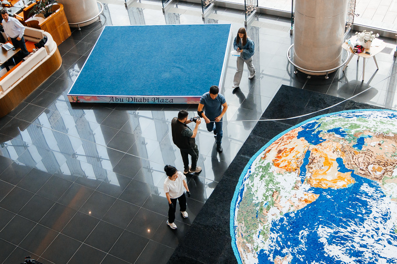 thousands of hand-rolled paper quills compose monumental mosaic earth artwork - 1