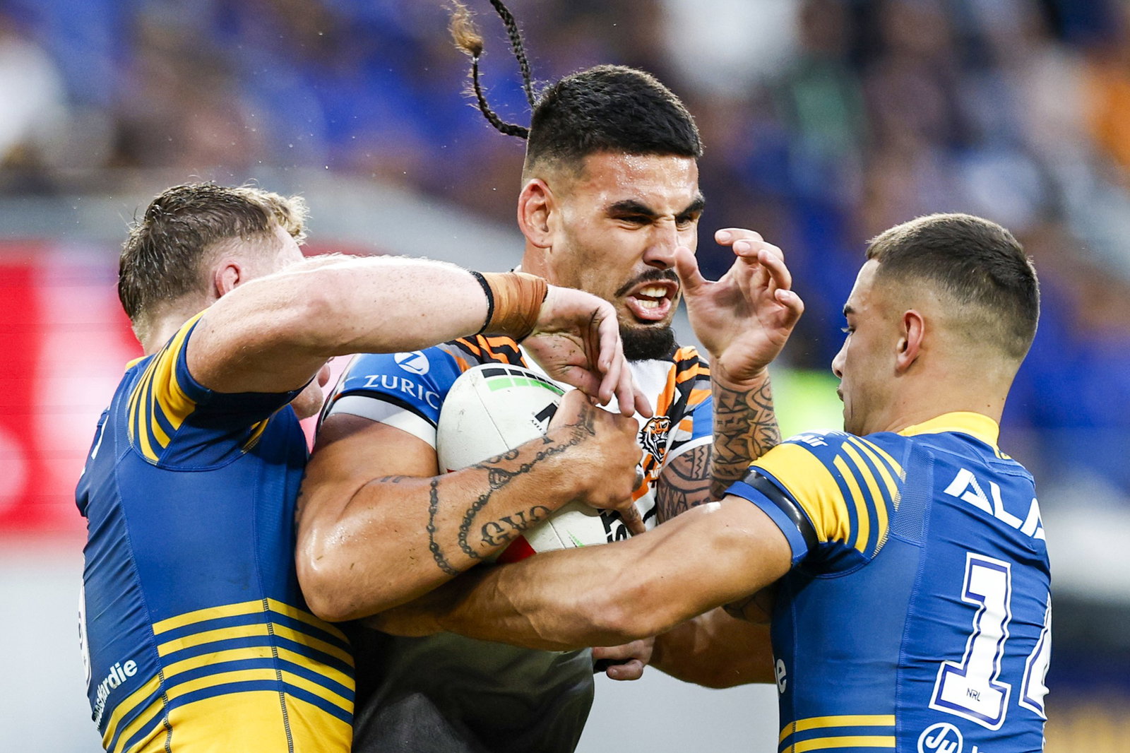 Terrell May of the Tigers is tackled during the NRL Round 5 match between the Parramatta Eels and the Wests Tiger