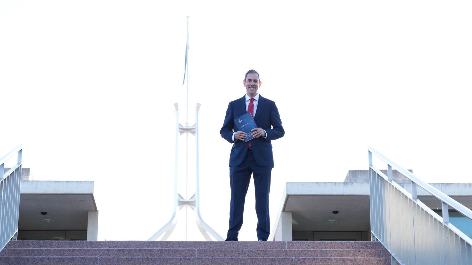 Chalmers stands at the top of a flight of stairs.