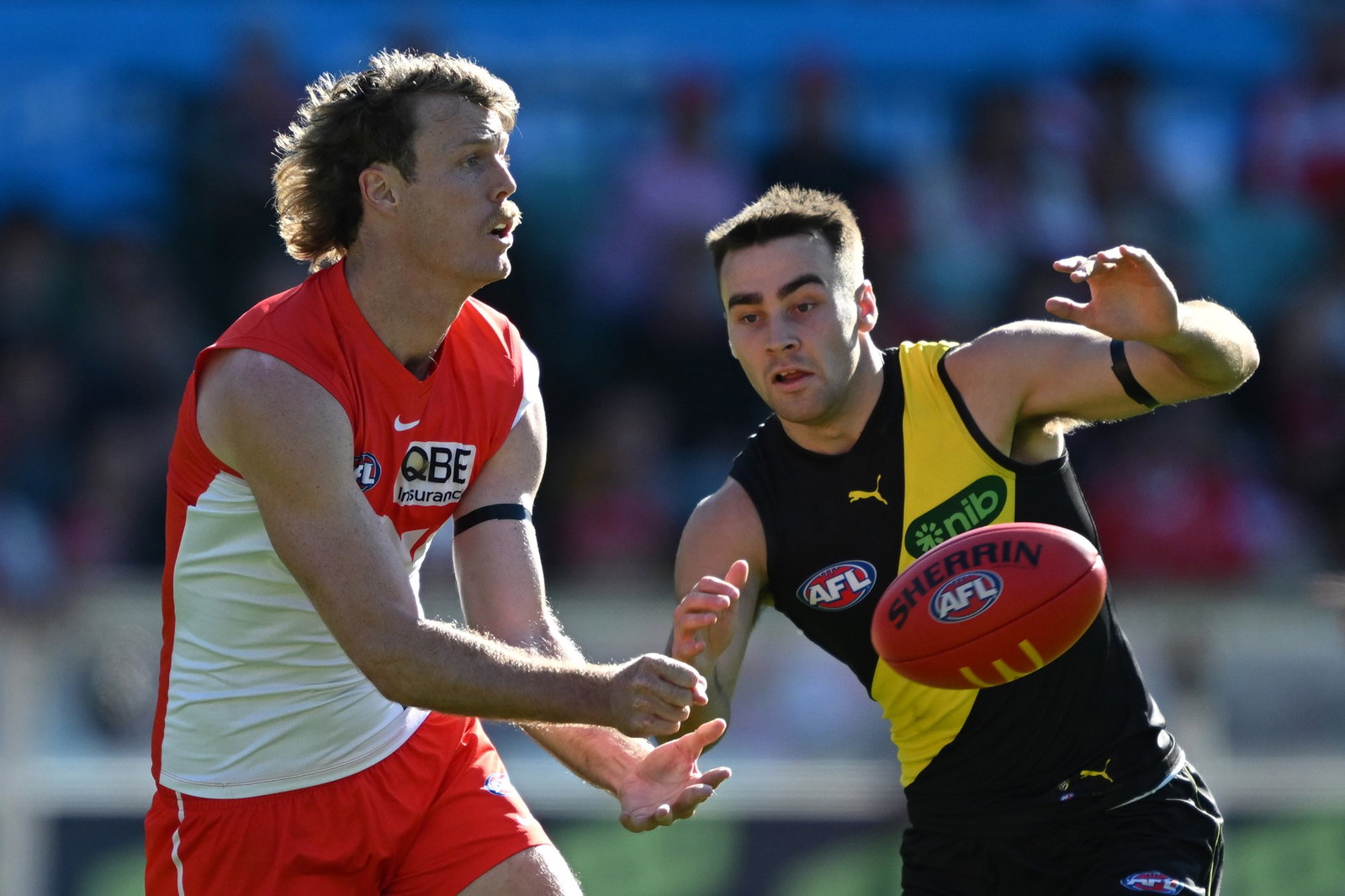 Nick Blakey handballs against Tigers.