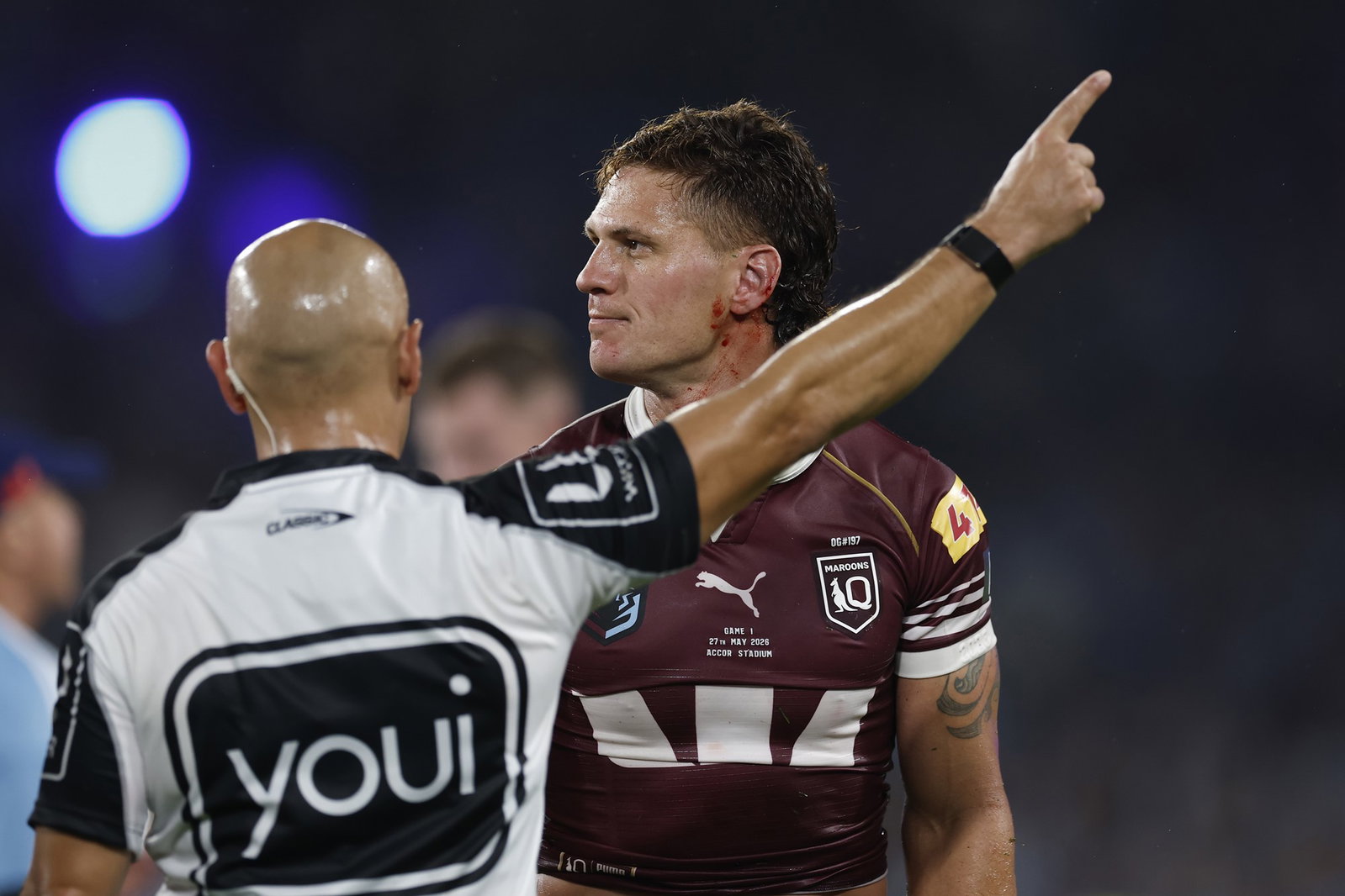 Kalyn Ponga of the Maroons is sent from the field by referee Ashley Klein
