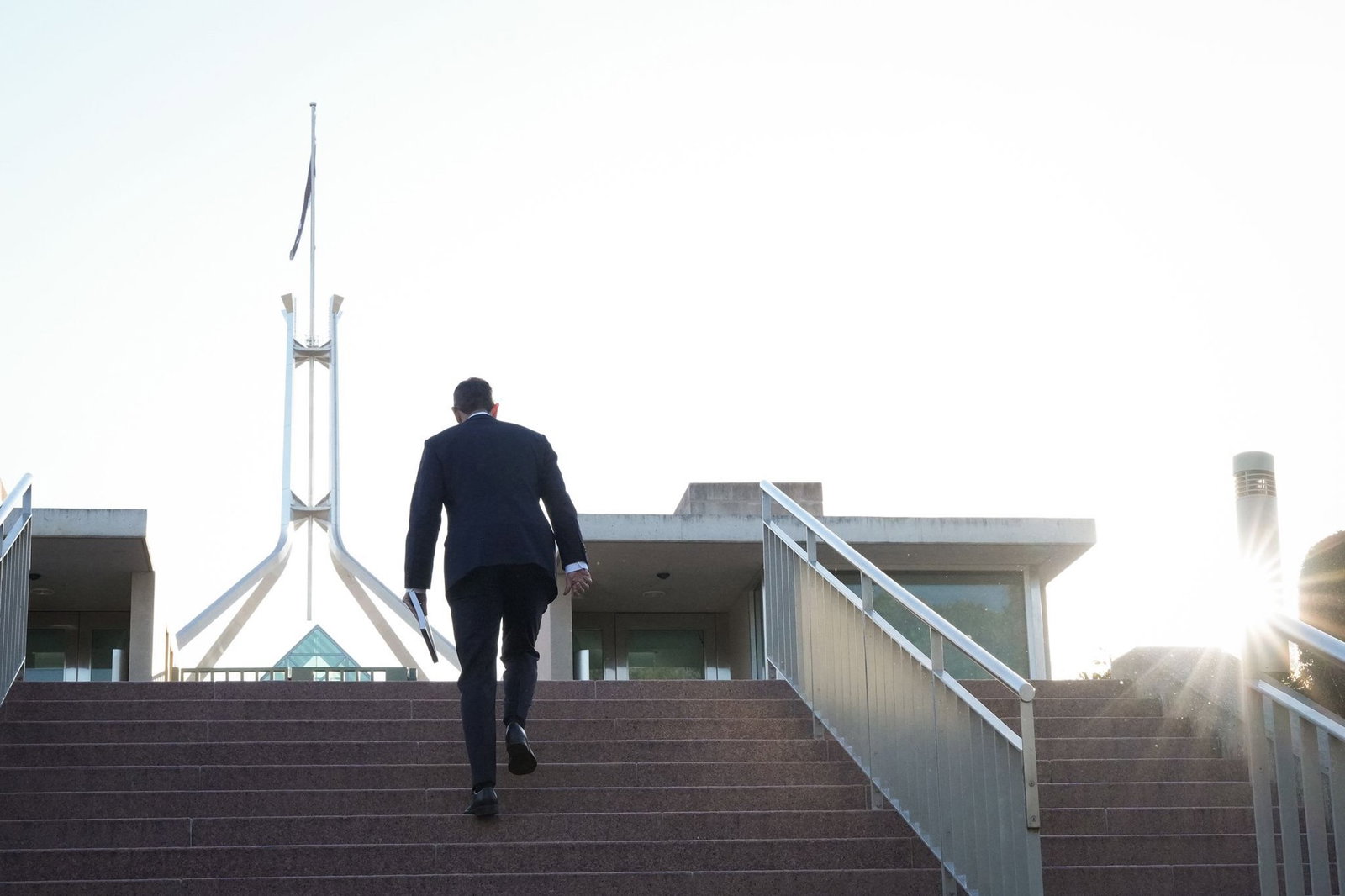 Chalmers walks to parliament house.