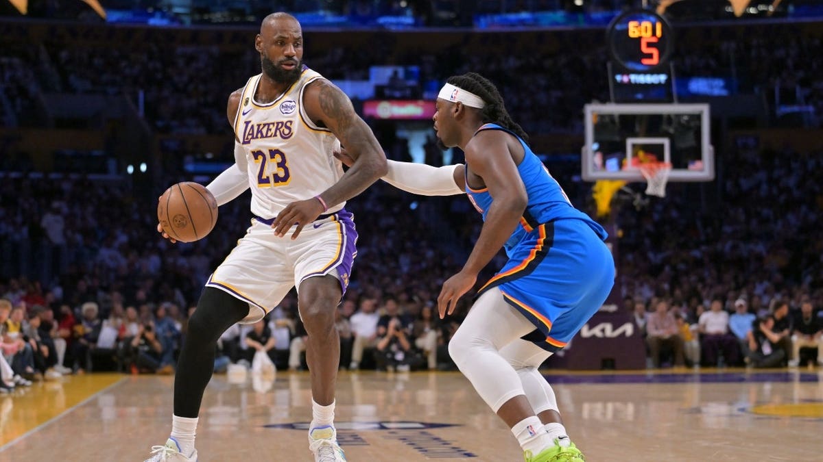 Los Angeles Lakers' LeBron James posts up Oklahoma City Thunder wing Lu Dort during Game 3 of their second-round series in the 2026 NBA Playoffs at Crypto.com Arena.