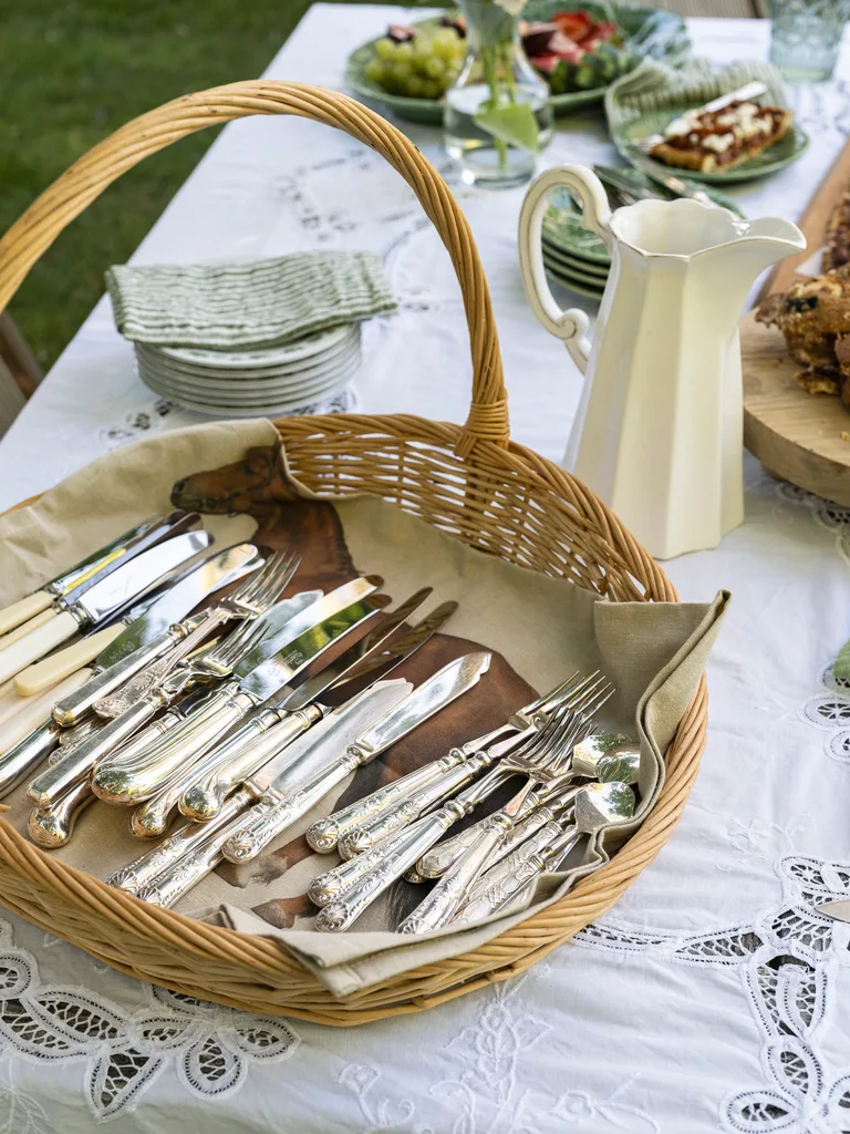 A basket of ornate cutlery