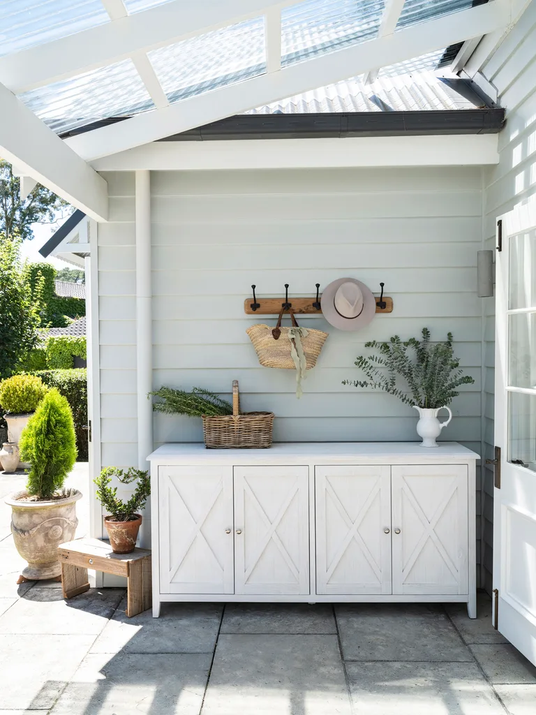 A covered outdoor area with a storage unit