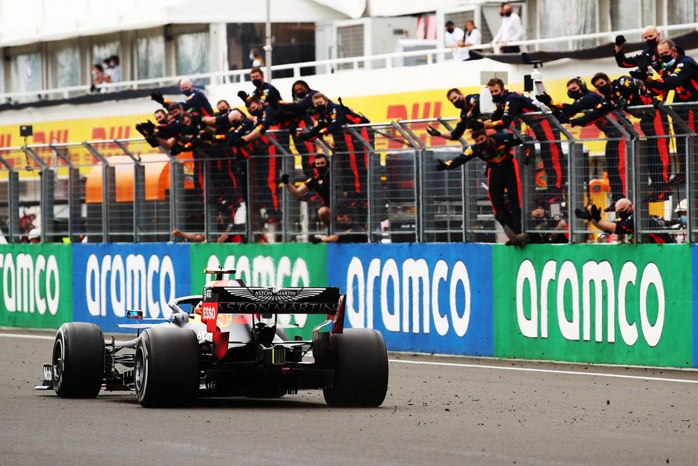 Max Verstappen,  Red Bull Racing RB16 celebrates with team members