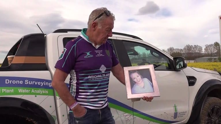 Meningitis Foundation chairman Gerard Rushton with a framed photo of his daughter Courtney.