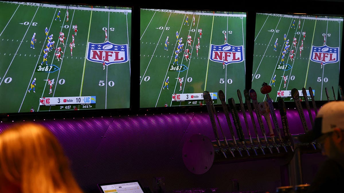Streaming service EverPass Media logo displayed on a TV screen in a sports bar