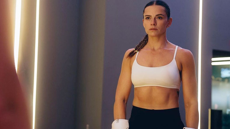 Skye Nicholson stands in boxing gloves and training gear during a workout session ahead of her move to super-bantamweight.