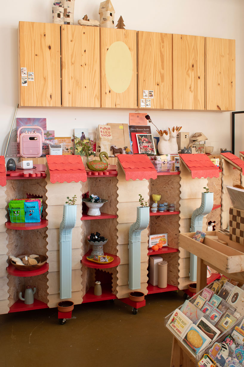 modular timber display rooms reinterpret the checkout counter as an open house facade - 1