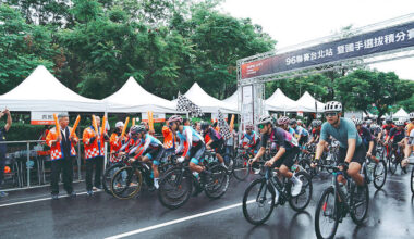 Cyclists race, officials sign partnerships