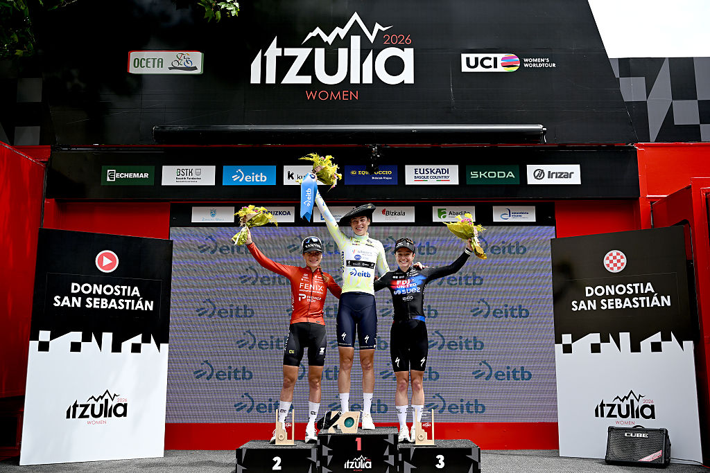 SAN SEBASTIAN, SPAIN - MAY 17: (L-R) Yara Kastelijn of Netherlands and Team Fenix-Premier Tech on second place, race winner Mischa Bredewold of Netherlands and Team SD Worx - Protime - Yellow Leader Jersey and Lauren Dickson of Great Britain and Team FDJ United - SUEZ on third place pose on the podium ceremony after the 5th Itzulia Women 2026, Stage 3 a 131.1km stage from San Sebastian to San Sebastian / #UCIWWT / on May 17, 2026 in San Sebastian, Spain. (Photo by Szymon Gruchalski/Getty Images)