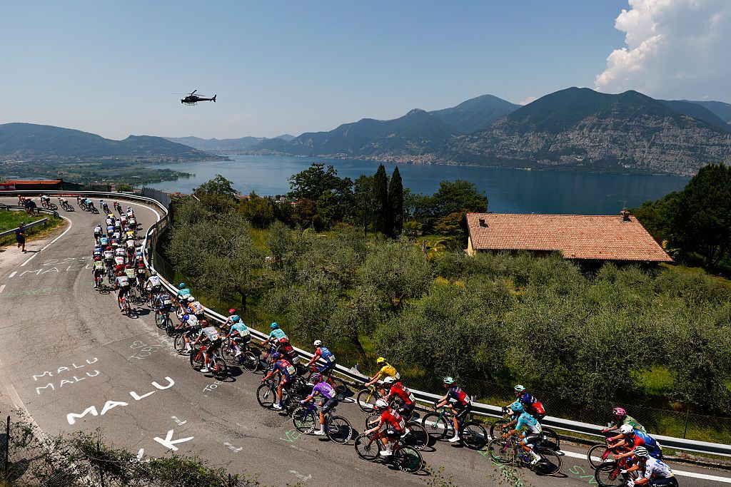 The pack rides during the 17th stage of the Giro d'Italia 2026 - Tour of Italy cycling race between Cassano d'Adda and Andalo, Italy, on May 27, 2026. (Photo by Luca Bettini / AFP)
