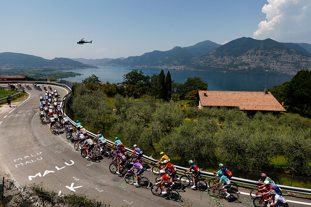 The pack rides during the 17th stage of the Giro d'Italia 2026 - Tour of Italy cycling race between Cassano d'Adda and Andalo, Italy, on May 27, 2026. (Photo by Luca Bettini / AFP)