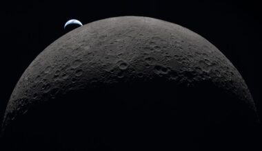 spacecraft view of the big, cratered moon with a tiny-looking crescent earth hovering slightly above it
