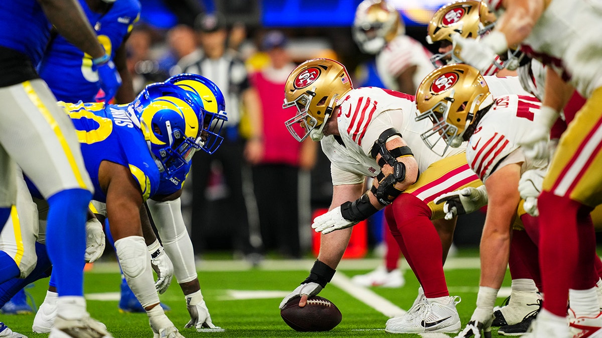 Los Angeles Rams players lining up against San Francisco 49ers at SoFi Stadium