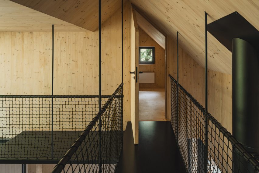 Spruce wood and black steel interior of cabin