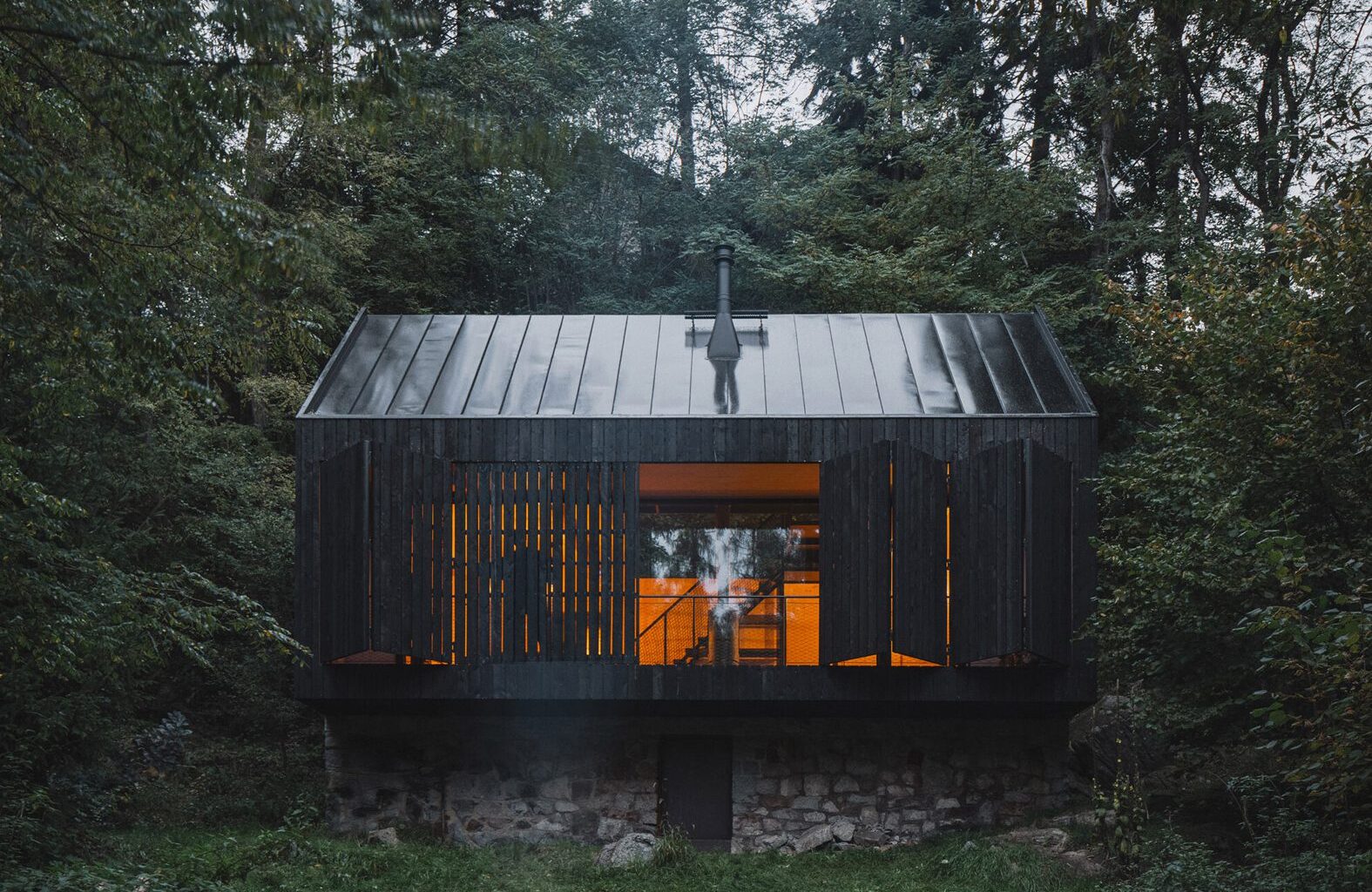 Mimosa Architects shapes Czech cabin from "rock, river and fire"