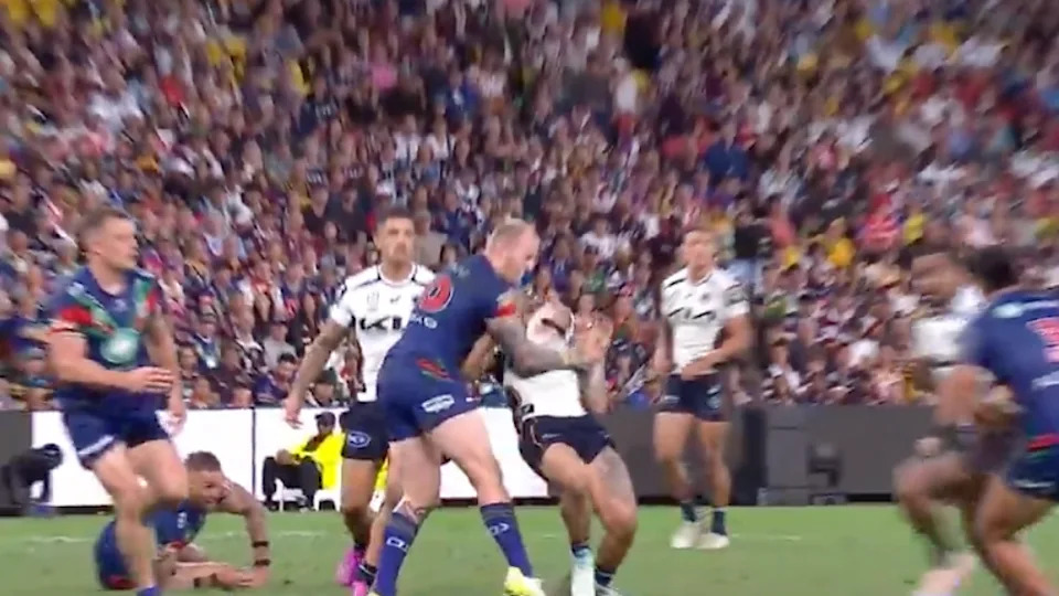 Reece Walsh cops a head knock.