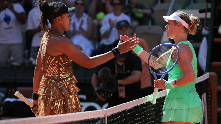 Naomi Osaka (L) shakes hands with Laura Siegemund (R) at the end of their French Open match