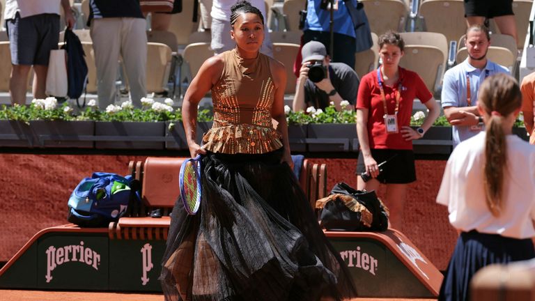 Japan's Naomi Osaka arrives on Court Suzanne-Lenglen to play her women's singles match against Germany's Laura Siegemund on day 3 of the Fre