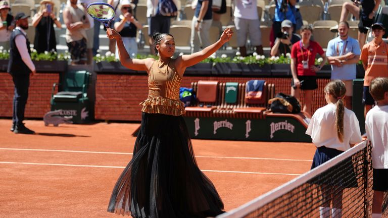 Naomi Osaka of Japan gestures before the first round women's singles tennis match against Laura Siegemund of Germany at the French Open tenn