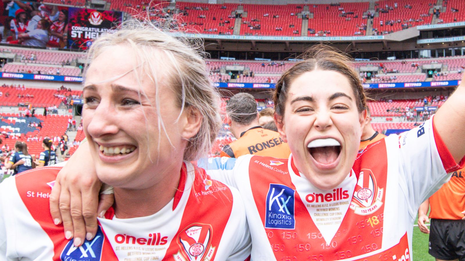 St Helens's Jodie Cunningham & Emily Rudge celebrate victory over Leeds.