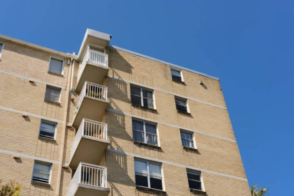Row of apartments with balconies.