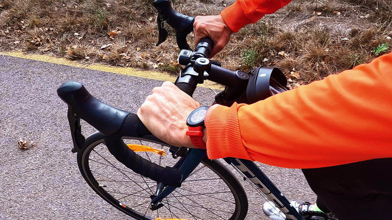 Close-up of cyclist with Garmin watch and Trek bike