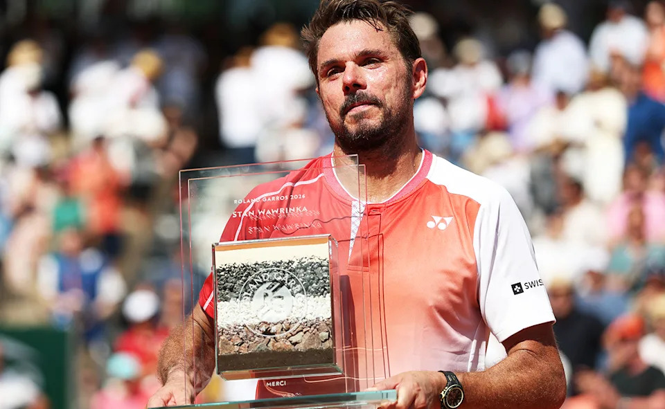 Stan Wawrinka, pictured here with a special trophy after the final match of his French Open career.