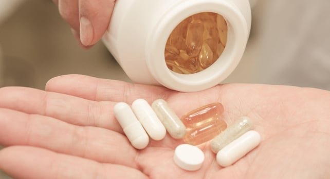 Supplements in a hand