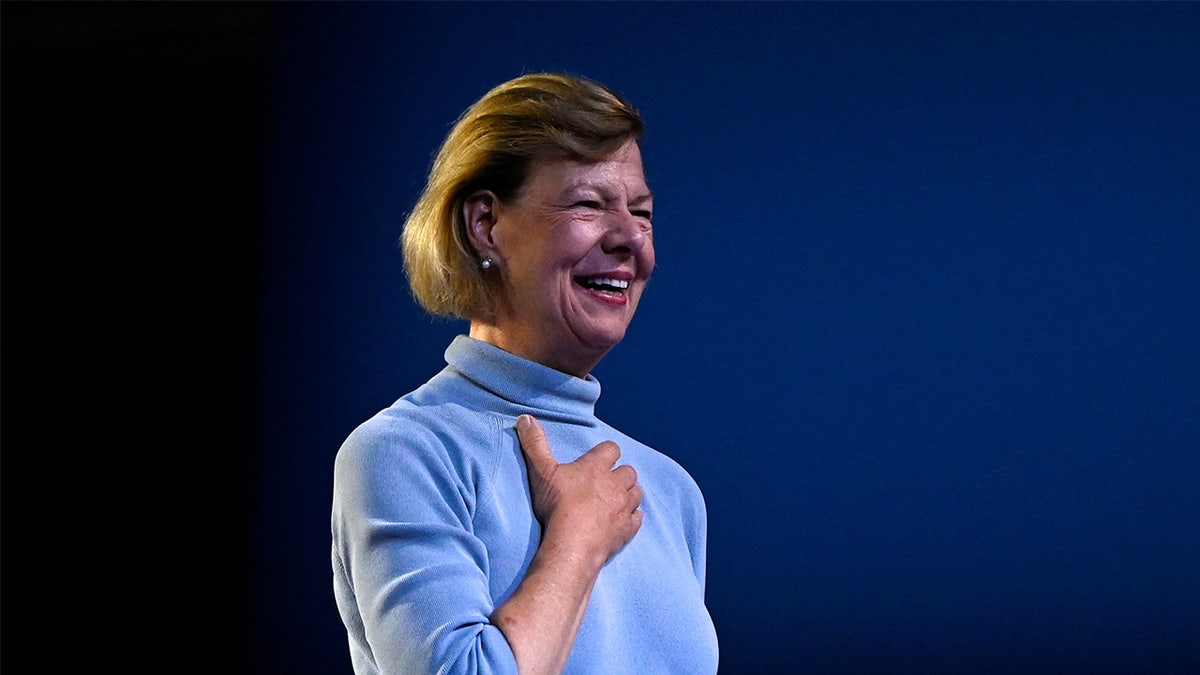 Sen. Tammy Baldwin speaking at a podium