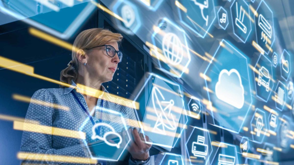 A corporate female wearing glasses looks intently at a virtual reality screen with shapes and lights representing Block shares going up today