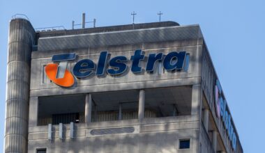 A close up of a large office building with the Telstra logo at the top.