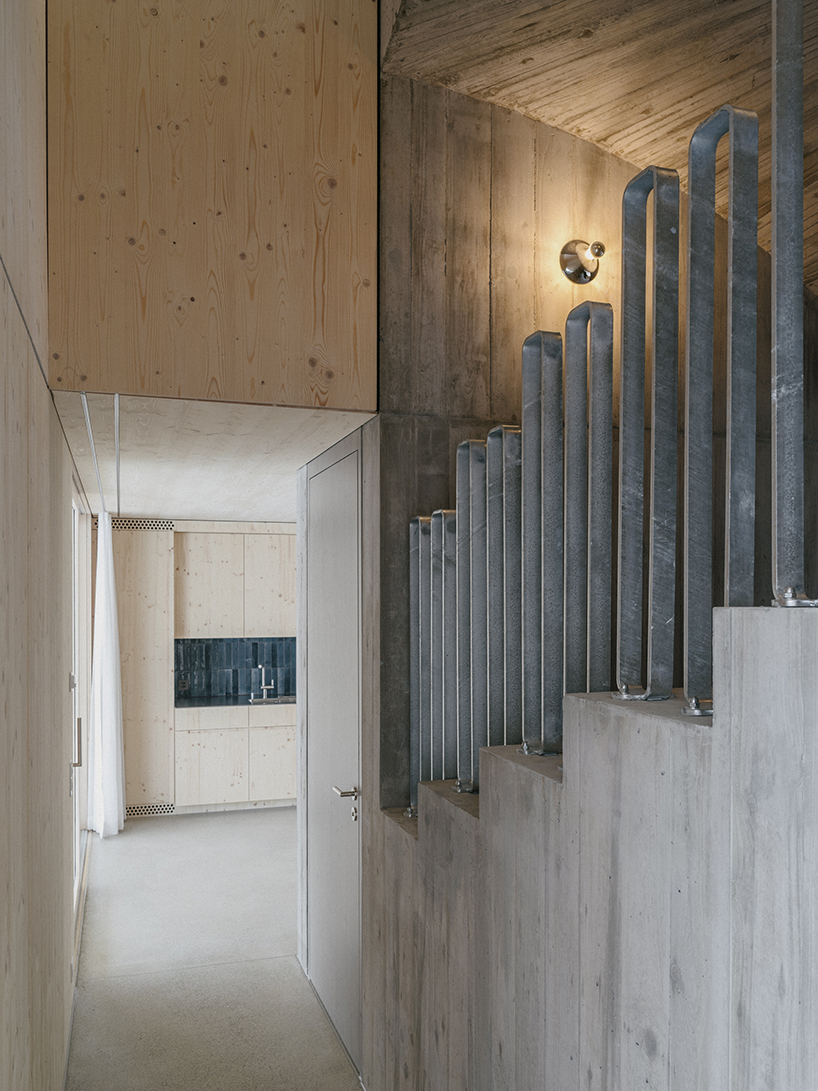the tower house explores vertical living through prefabricated timber design 7
