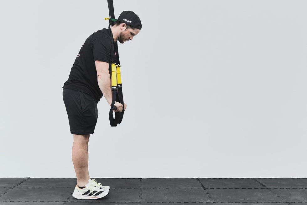 Person performing a TRX exercise.
