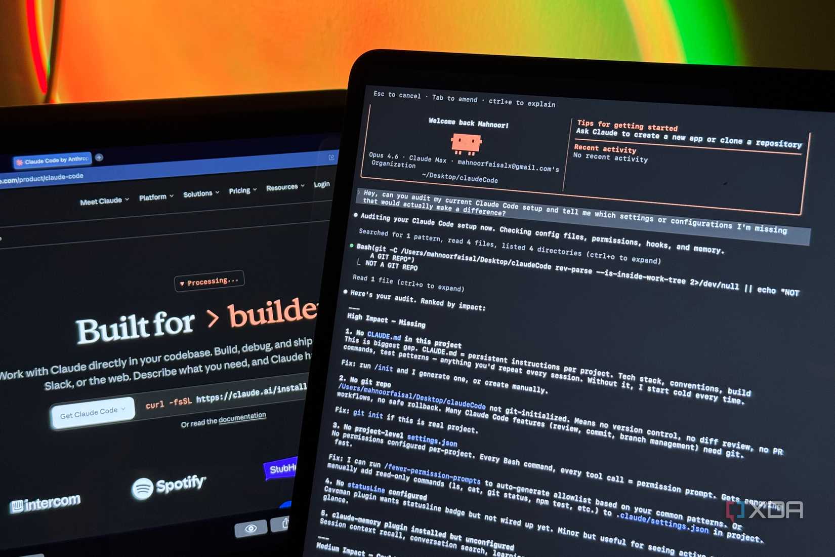 two laptop screens displaying claude ai documentation and code interface with colorful gradient background lighting