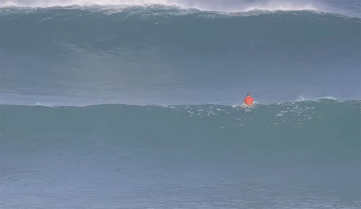 Surfer sitting at Uluwatu