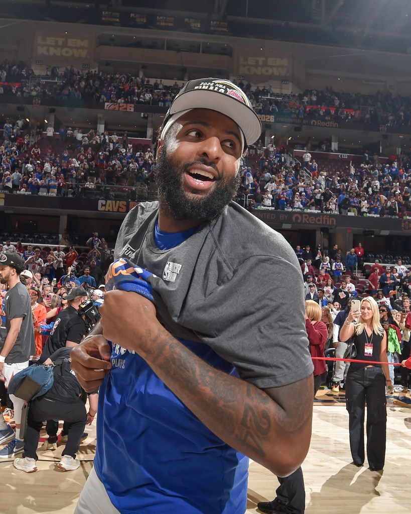 Mitchell Robinson of the New York Knicks smiling after a win against the Cleveland Cavaliers.