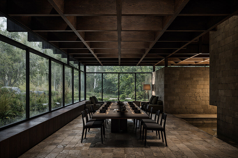 V taller proposes forest retreat around monolithic stone core for NOT A HOTEL in japan - 7