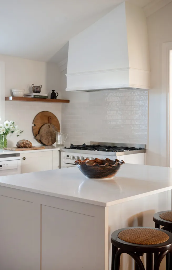 A white kitchen with subway tiles