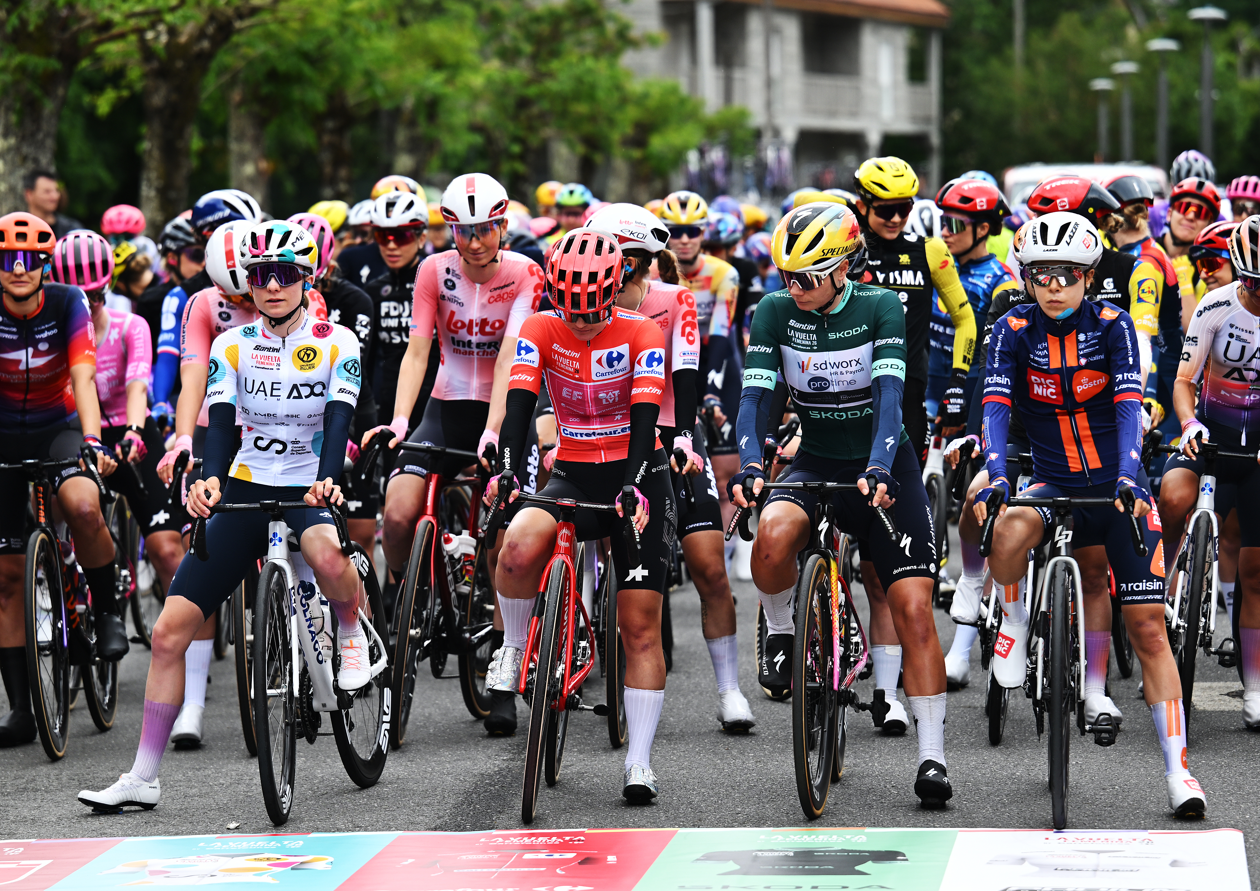 LOBIOS, SPAIN - MAY 04: A general view of Maeva Squiban of France and UAE Team ADQ - Polka dot Mountain Jersey, Noemi Ruegg of Switzerland and Team EF Education-Oatly - Red Leader Jersey, Lotte Kopecky of Belgium and Team SD Worx - Protime - Green Points Jersey and Eleonora Ciabocco of Italy and Team Picnic PostNL prior to the 12th La Vuelta Femenina 2026, Stage 2 a 109.8km stage from Lobios to San Cibrao das Vinas / #UCIWWT / on May 04, 2026 in Lobios, Spain. (Photo by Szymon Gruchalski/Getty Images)
