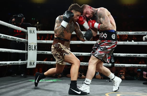 Liam Paro punches Lewis Crocker during the IBF World Welterweight Title bout at Pat Rafter Arena on June 24, 2026 in Brisbane, Australia.