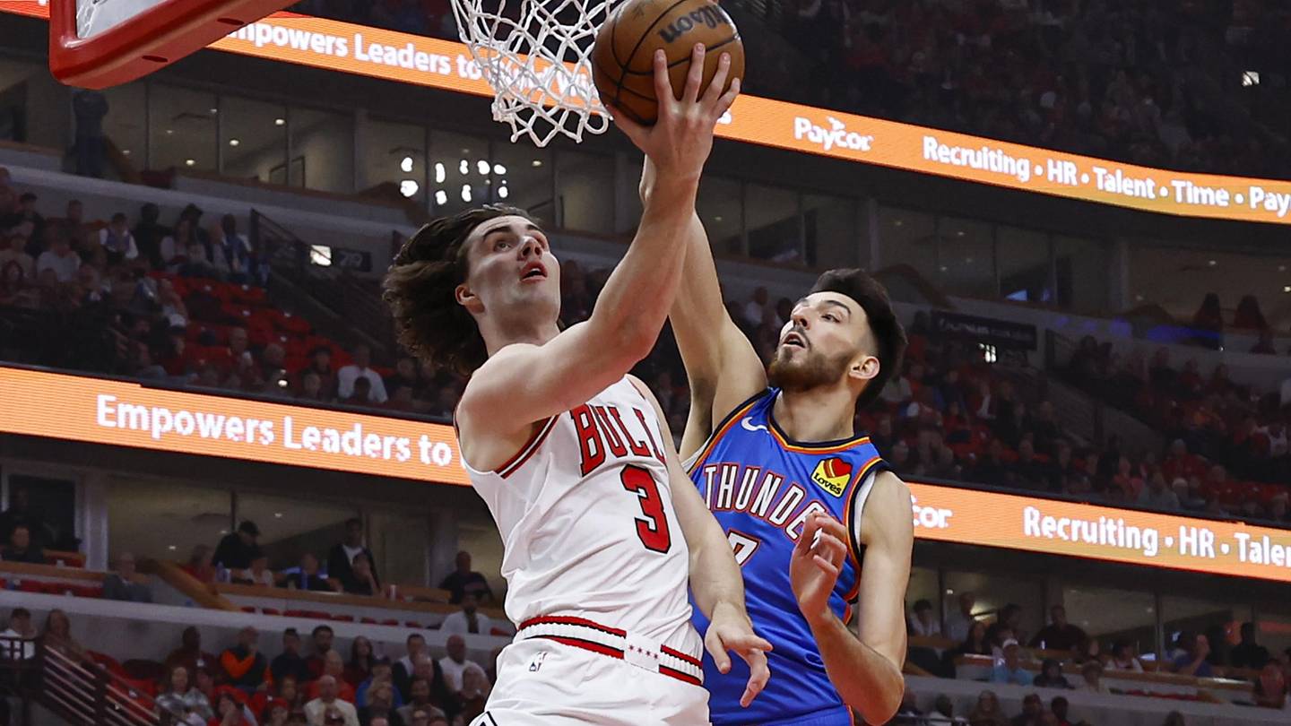 Oct 26, 2024; Chicago, Illinois, USA; Chicago Bulls guard Josh Giddey (3) goes to the basket against Oklahoma City Thunder forward Chet Holmgren (7) during the first half at United Center. Mandatory Credit: Kamil Krzaczynski-Imagn Images