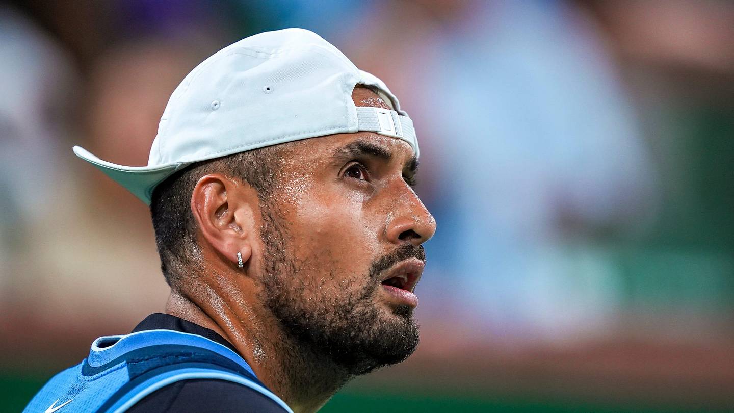 Nick Kyrgios looks up at the video boards before a point