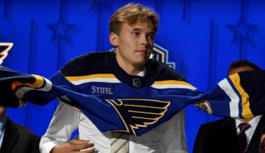 Jun 28, 2023; Nashville, Tennessee, USA; St. Louis Blues draft pick Theo Lindstein puts on his sweater after being selected with the twenty ninth pick in round one of the 2023 NHL Draft at Bridgestone Arena. Mandatory Credit: Christopher Hanewinckel-Imagn Images